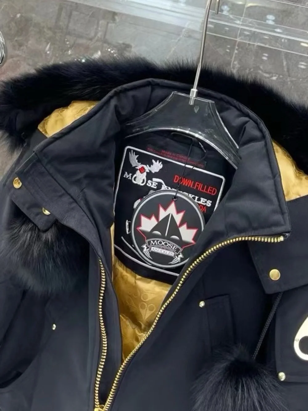 Moose Knuckles Black Hooded Puffer Jacket with Gold Lining